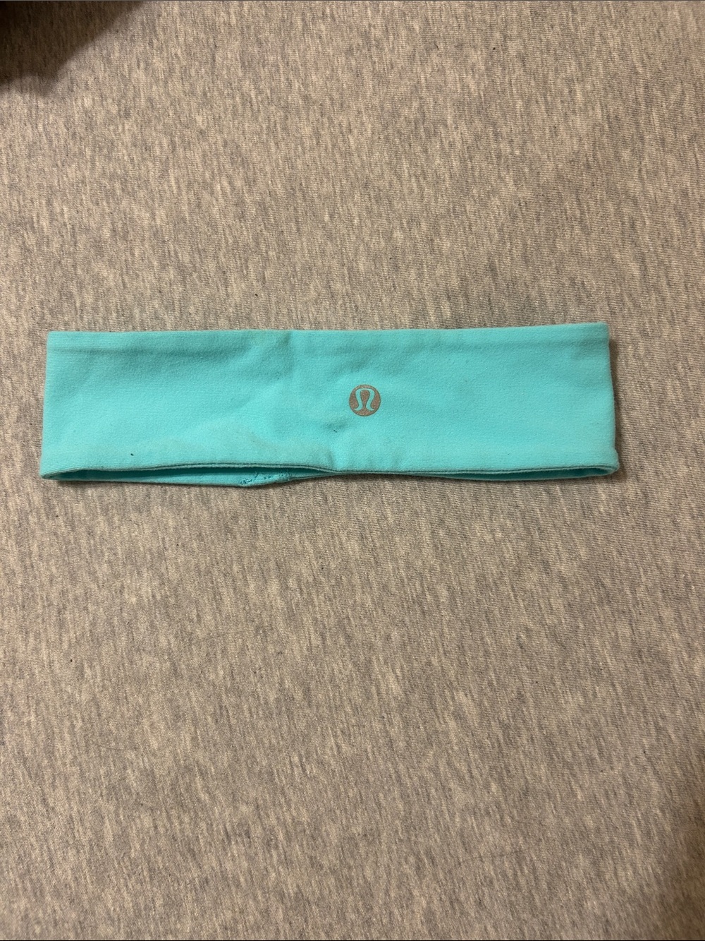 lululemon athletica aqua headband with reflective logo